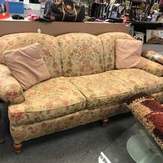Pink and green floral sofa